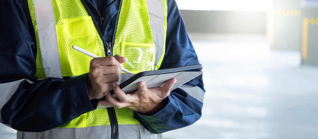 A man with a tablet conducts an electrical inspectionPicture